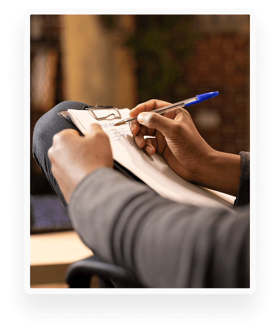 A professional taking notes